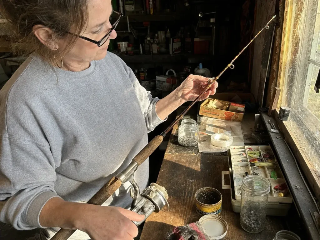Inspecting the guides on an inherited vintage fiberglass rod before fishing it again